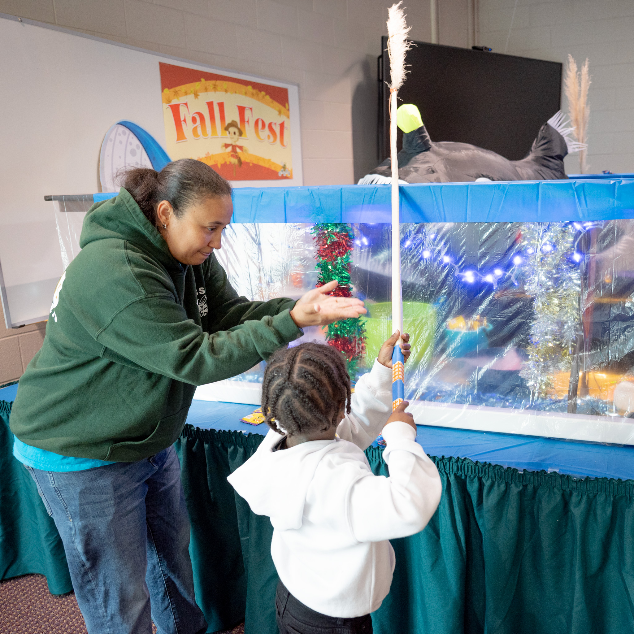 Fall Fest: Melissa with student fishing at Dave's Fishin' Hole