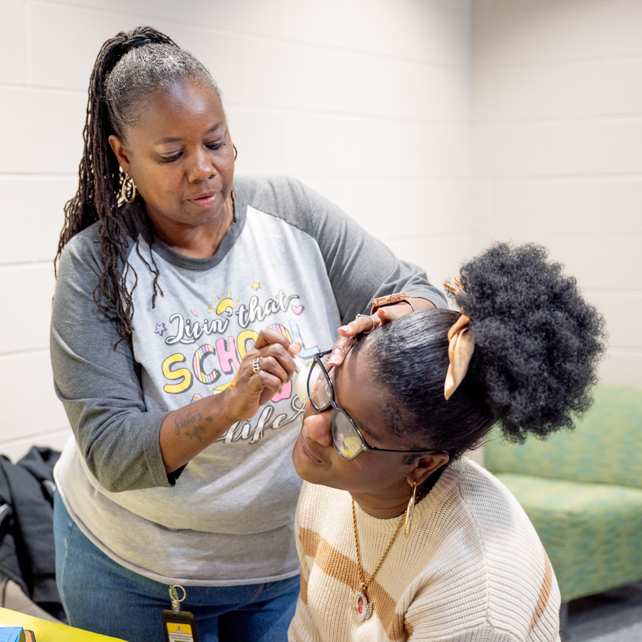 Fall Fest: Faith paints a student's face
