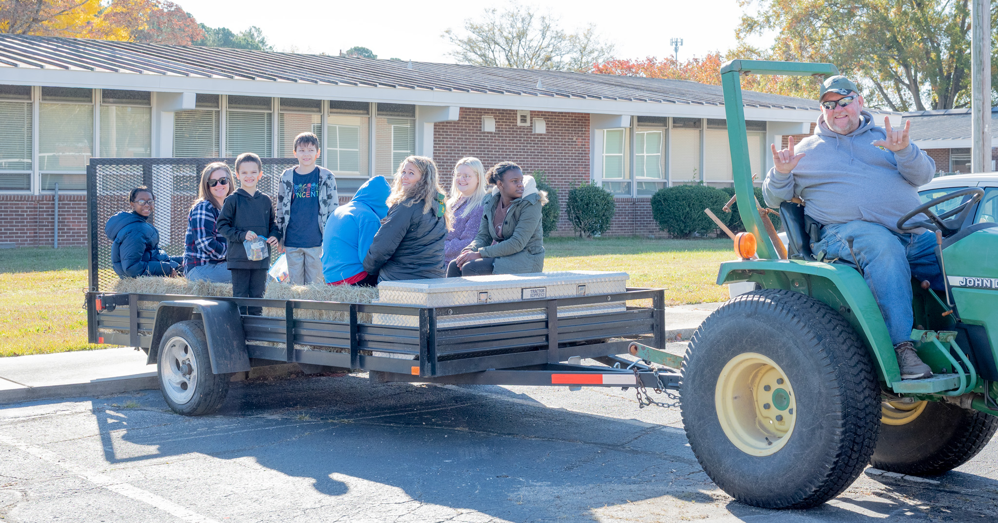 Fall Fest: Students and staff pulled on a hayride by Jeff