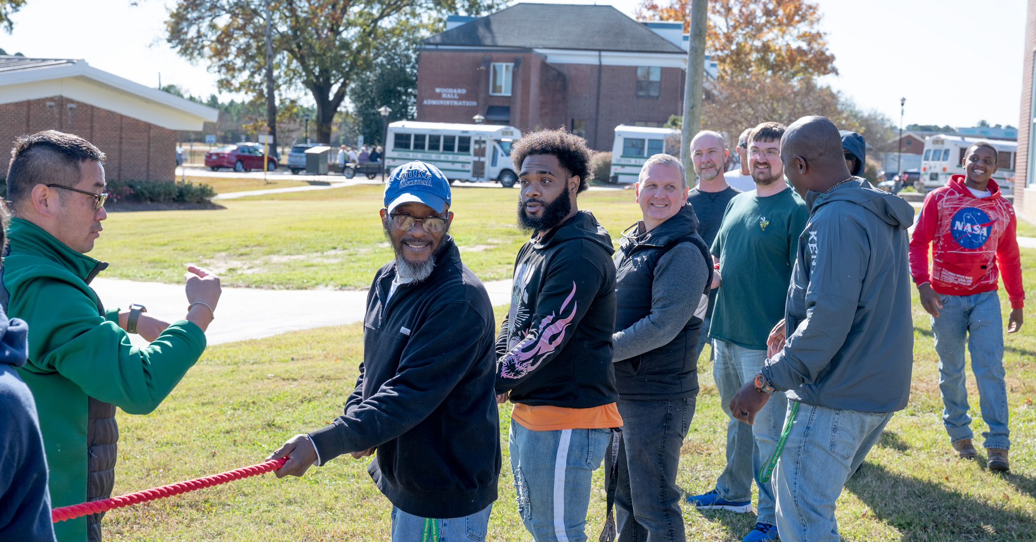 Fall Fest: Men staff members preparing for tug-of-war on the rope